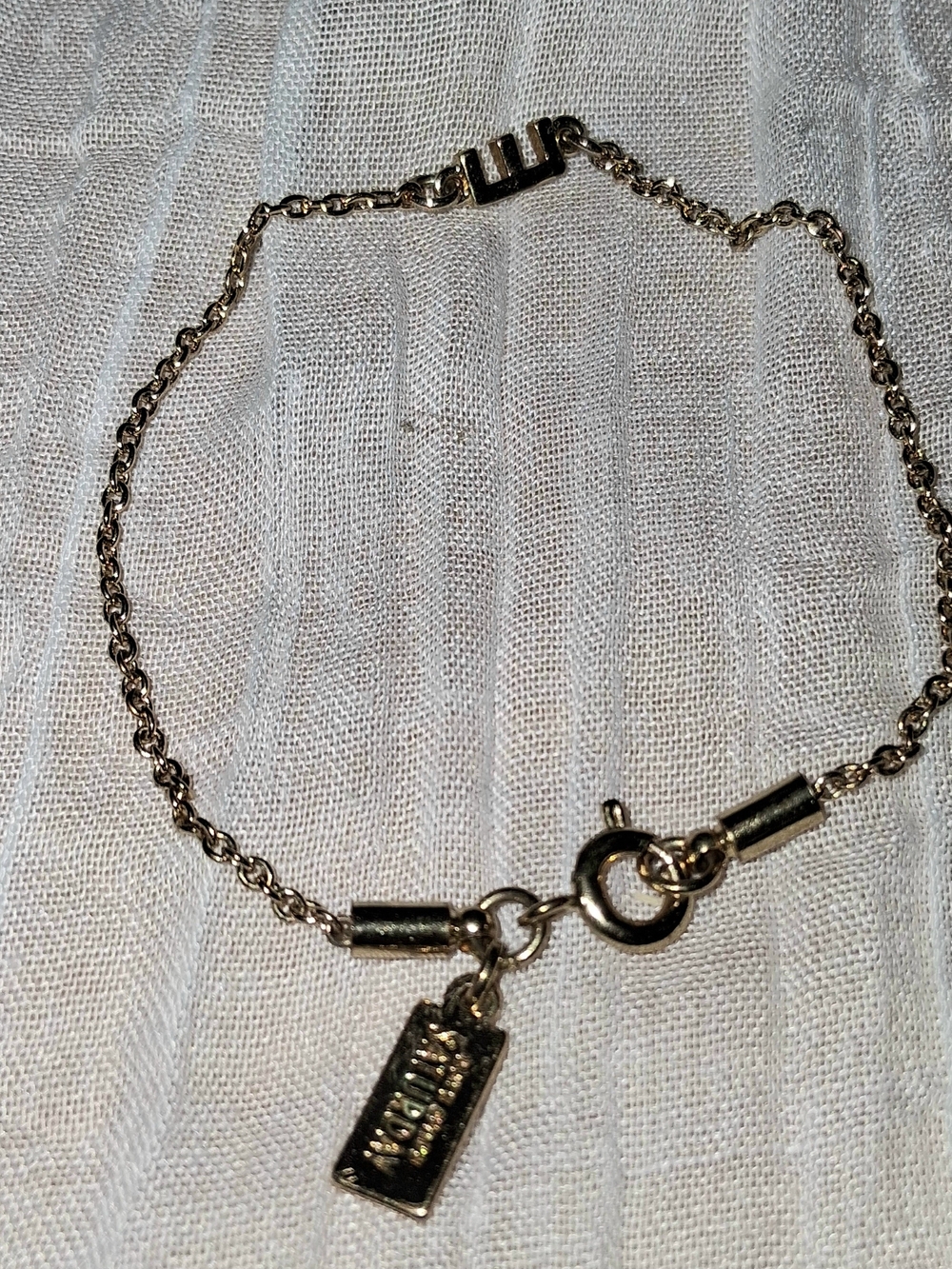 kate spade gold tone delicate chain bracelet with logo charm
